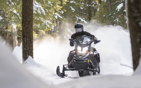 Snowmobiler riding with Tranz 1.5 AMS helmet